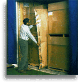 This man is placing the inflatable dunnage bag in between the cargo he is protecting from damage.